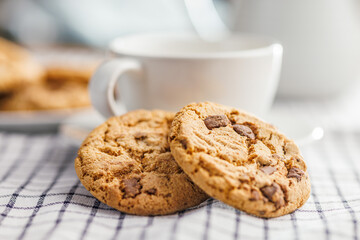 Sweet chocolate cookies on checkered napkin.