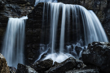 Obraz premium Powerful waterfall in dark colors