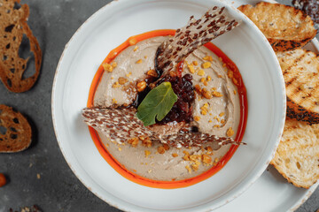 Mushroom cream soup on dark background. Champignon soup