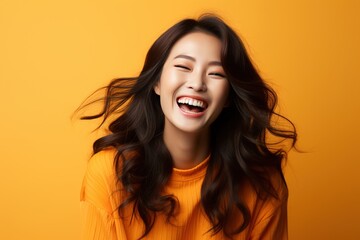 Laughing Asian woman with long hair