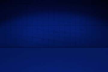 Dark blue studio background. A room illuminated with blue light. A floor and a tiled wall illuminated by a neon colored spotlight