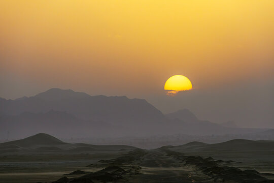 Iran. Sunset at Khara Desert (part of Varzaneh Desert)