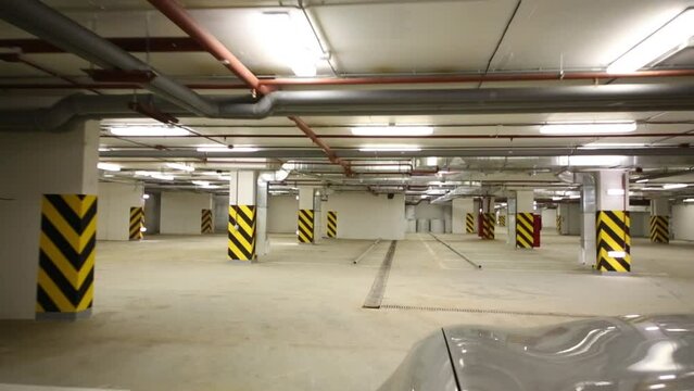 Movement of a car on a large empty underground parking