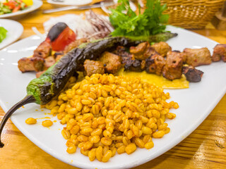Turkish and Arabic Traditional Ramadan Kebab. Ramadan Kebab is a dish of lamb, lamb, chickpea, eggplant, onion, and spices.