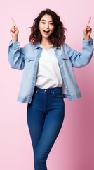 Obraz premium Happy young Asian woman in casual outfit