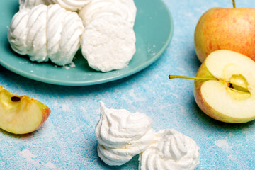 Delicious apple marshmallow. Handmade marshmallows made from applesauce. Blue background