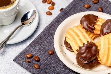 Chocolate shortbread cookies. Light background. Selective focus