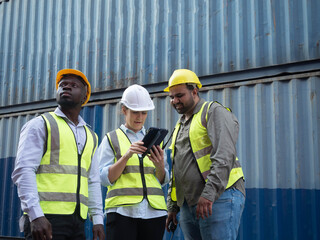 Group teamwork female male man woman person people human white yellow hardhat safety look see watch report tablet smartphone mobile order work job import export container copy space education study 