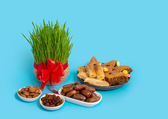 The vernal equinox, a traditional table on Navruz. wheat grass, Arabic baklava dessert, sweets, nuts, dried fruits