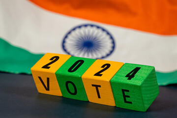 India vote 2024, Wooden blocks inscription vote 2024 with the Indian flag. Concept, voting and elections in India - obrazy, fototapety, plakaty