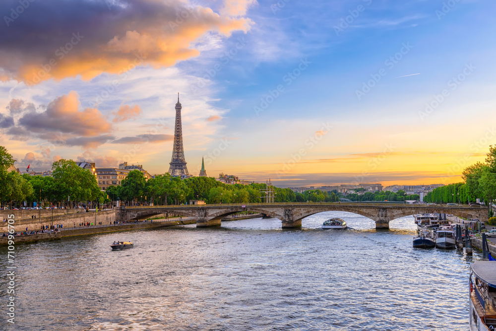 Sticker sunset view of eiffel tower and seine river in paris, france. eiffel tower is one of the most iconic
