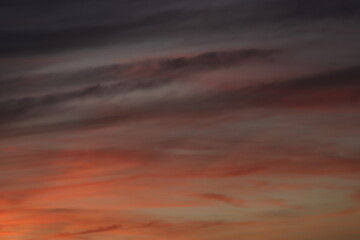 A breathtaking sunset sky painted with a palette of deep reds and oranges, a dramatic backdrop that evokes a sense of calm and wonder.