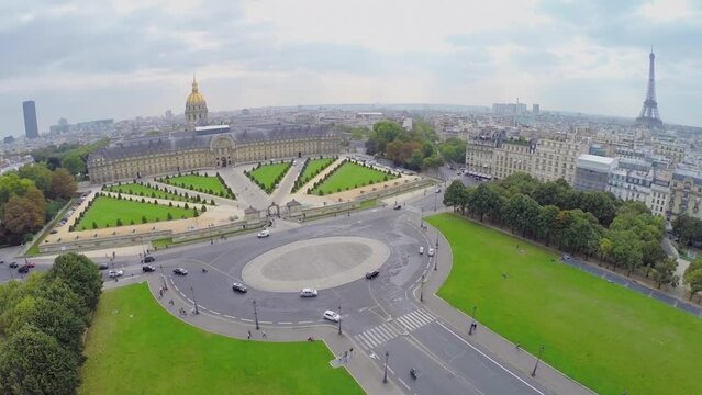 Cityscape with Eiffel Tower and traffic on square 