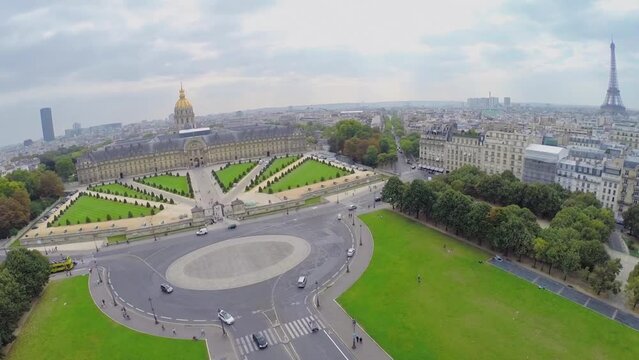 City panorama with Eiffel Tower and traffic on square 