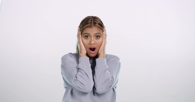Surprise, wow and face of woman in studio with mistake, fail or oops body language on white background. Omg, portrait or lady model with mind blown gesture, emoji or expression for bad news or regret