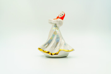 Porcelain figurine, ceramic woman, traditional dress, attire. Headscarf, gold-trimmed glaze. Folk...