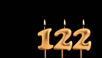 Golden candle 122 with flame - Birthday card on dark luxury background