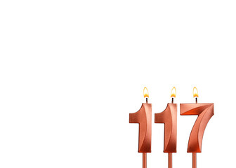 Burning candle number 117 for birthday on white background