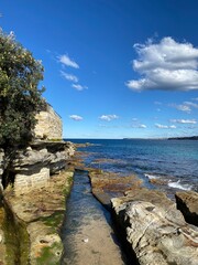 Rocky coast of the ocean. Bay and belvedere. Landscape, cliff and shore in Sydney, Australia. 