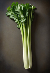 Obraz premium New, well-formed celery on a weathered kitchen surface.