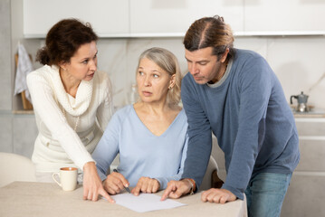 Adult married couple helps elderly woman make will, application for loan, application for settlement in nursing home. - obrazy, fototapety, plakaty