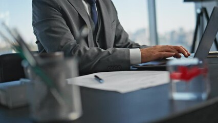 Closeup businessman open laptop in office. Worker hands typing computer online