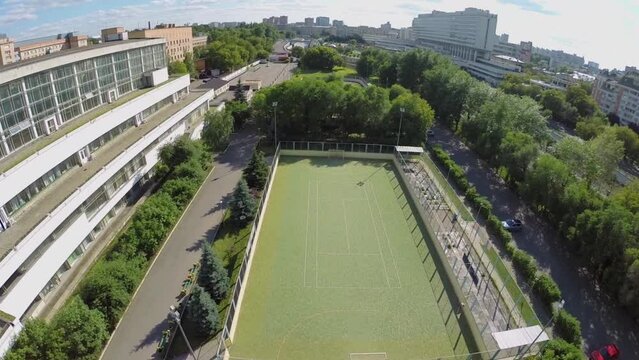 Cityscape with playground near edifice of sports complex of MGTU
