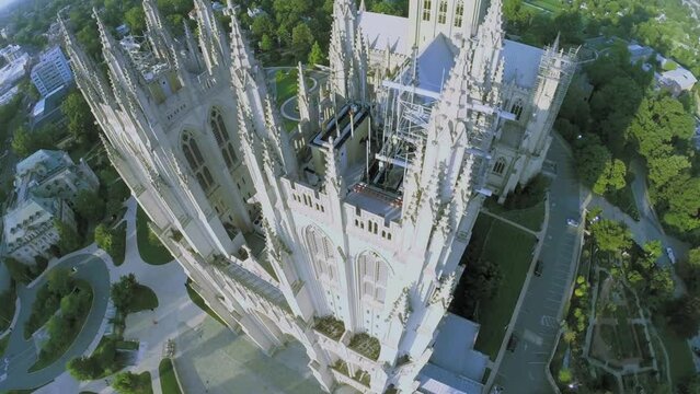 Birds fly above edifice of Washington National Cathedral 