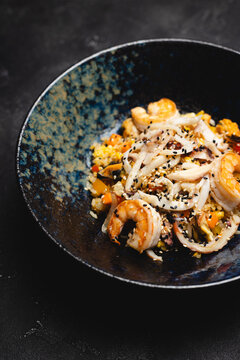 Fried rice with seafood, squid and tiger prawns. Food photography, restaurant, menu.