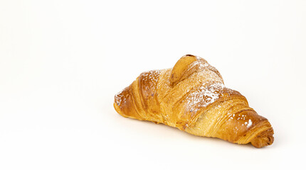 Croissant made from puff pastry, front view. The concept of confectionery baking.