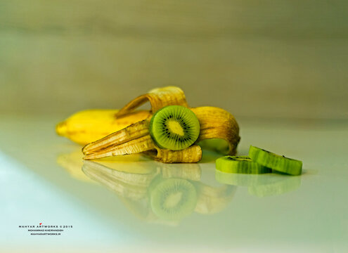 snail on a green leaf ،banana or kiwi? 