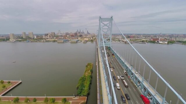 Benjamin Franklin Bridge with vehicle traffic at autumn cloudy day