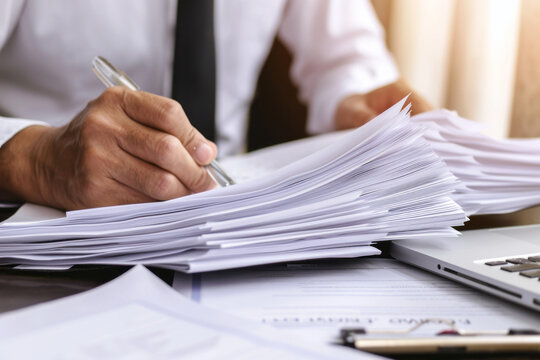 Man Sitting at Desk With Papers, Office Work, Business Concept