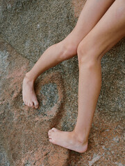 Sensual Summer: A Beautiful Woman Enjoying the Beach, Posing in Sexy Swimwear with Gorgeous Legs, Embracing the Sun in a Tropical Paradise.