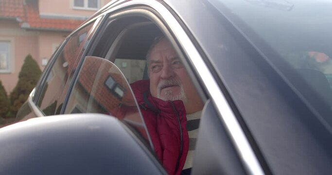 Portrait of a senior man seated in the passenger seat of a car. Human side of relocation and life's inevitable transitions, real and relatable narrative of a senior navigating through the complexities