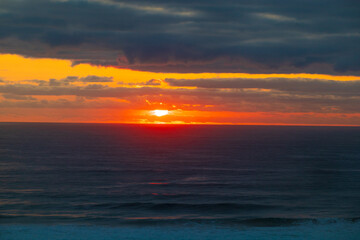 Fototapeta premium A Golden Dawn Breaks Over Gold Coast’s Tranquil Sea