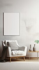 White armchair with gray cushions and a gray blanket in front of a blank wall