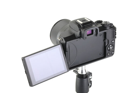 Black and Modern digital mirrorless Camera with lens on white background.
