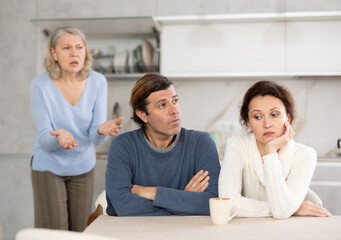 Outraged elderly female pensioner scolds her son and daughter-in-law for infantile behavior,...