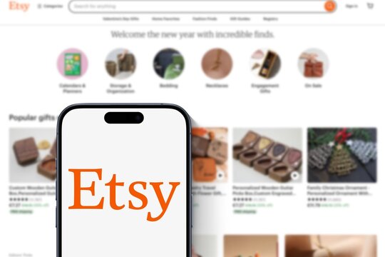 Modern smartphone shows app Etsy Logo, online marketplace, website of the trading platform behind, sales platform, e-commerce, internet, shipping