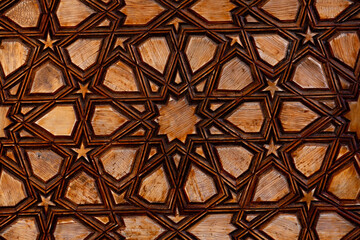 Islamic style geometric carving detail with intricate star shapes
