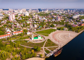 Aerial view of Admiralty square of Voronezh with Assumption Church and Ship Museum on background with modern cityscape, Russia..