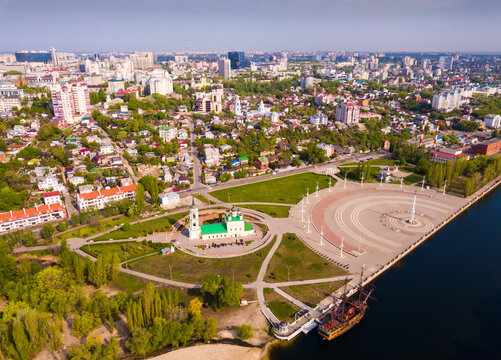 Aerial view of Admiralty square of Voronezh with Assumption Church and Ship Museum on background with modern cityscape, Russia..