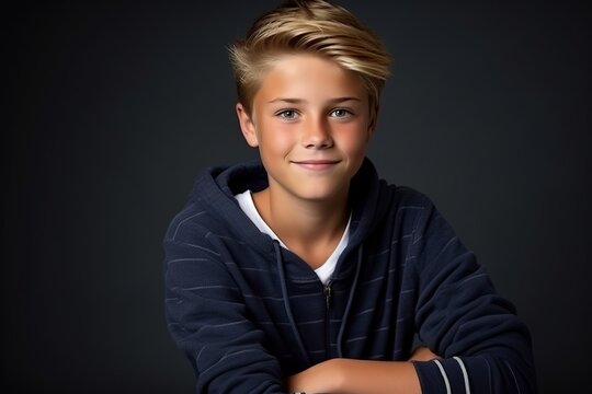 Portrait Of A Handsome Teen Boy. Studio Shot Over Dark Background.