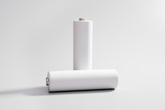 Two AA-sized white rechargeable 1.2V batteries
