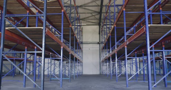 Building, factory and empty shelf for storage, distribution or inventory for logistics. Warehouse, plant and storehouse room for cargo, stock and interior of shipping depot for freight in industry