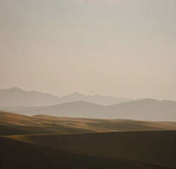 Obraz premium Landscape with fog. misty morning in the mountains. Minimalist background with empty copy space. Nature backdrop. Beautiful natural flyer, card design. Nature Template for presentation or product. 