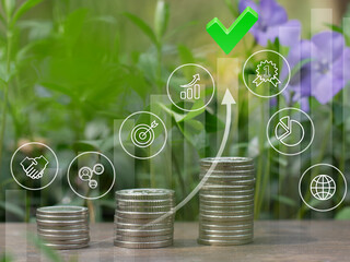 Investments concept.The emblems of the cyclic economy On green backdrop,.Stacs of money. Recycling,...