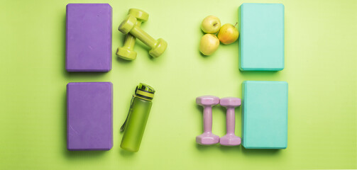 green light green background with fitness yoga items