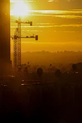  construction site during sunset with palm trees © Corbin